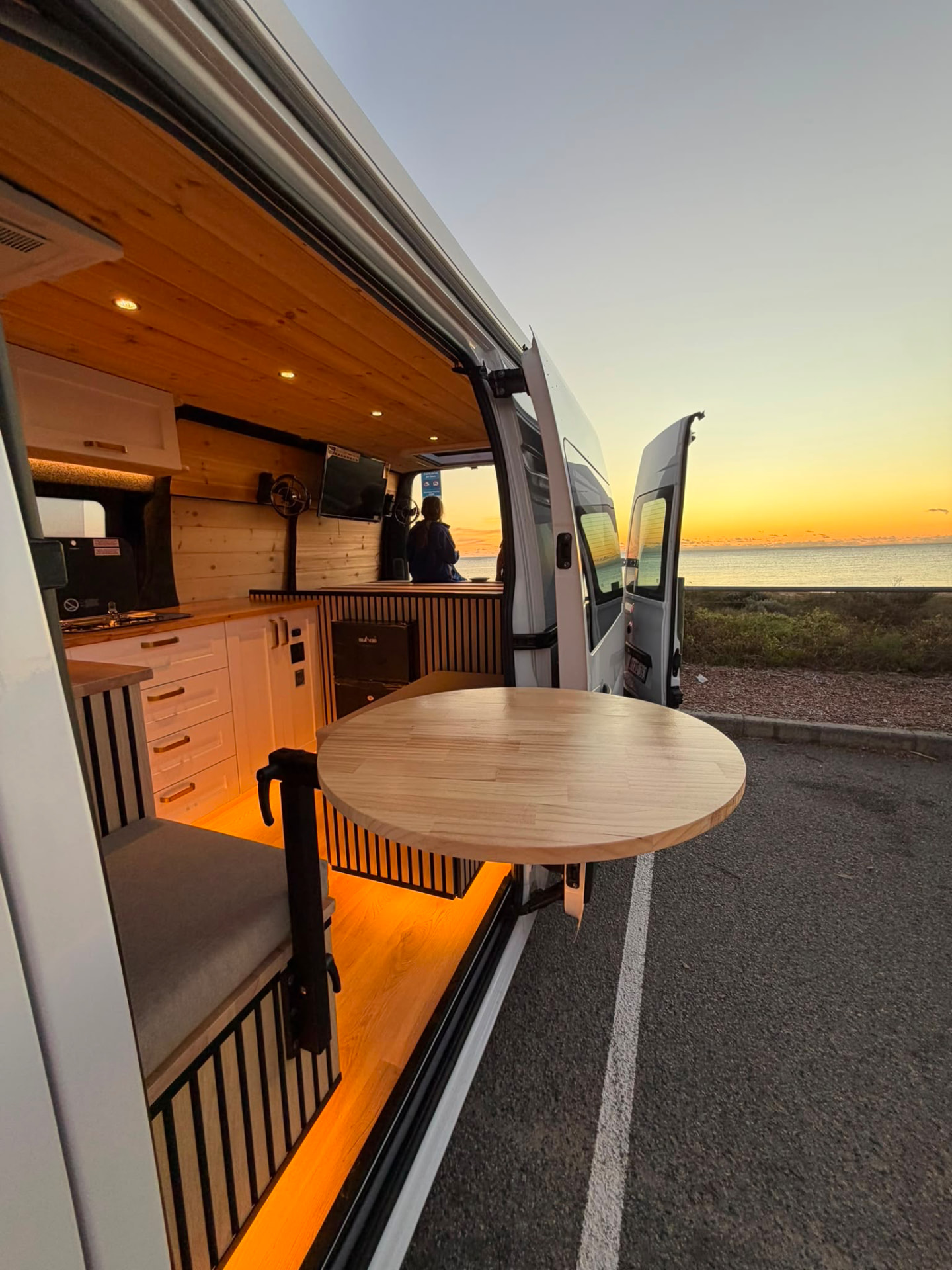 Campervan interior fit-out with swivel table by Motor Homes WA